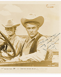 <b>Swann, Nov. 6:</b> Lot 8: James Dean, Photograph Signed and Inscribed, still from <i>Giant,</i> 1955.