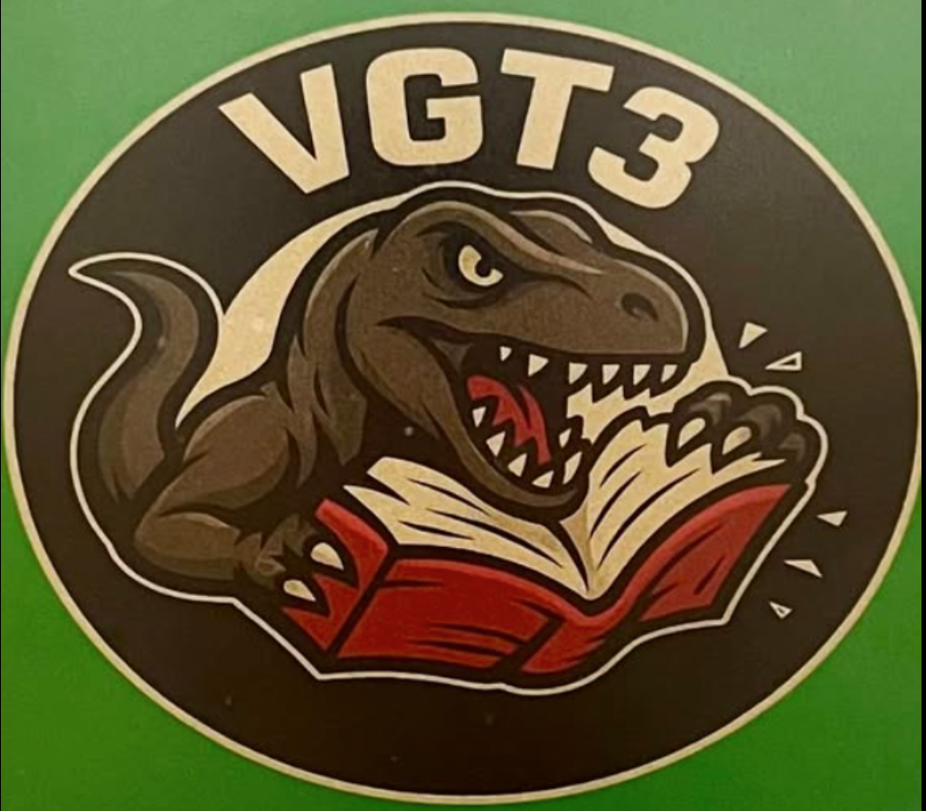 VGT Logo shows alligator consuming, literally, a book.